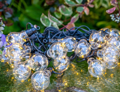 Светодиодная гирлянда Party Lights - СВЕТЛЯЧКИ В ЛАМПОЧКАХ прозрачная, 20 ламп, 100 экстра тёплых белых микро LED-огней, 10 м, коннектор, чёрный провод, уличная, Winter Deco фото 2